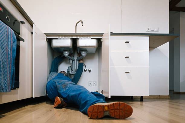 Professional Emergency Plumber technician working in Mapleton, ND
